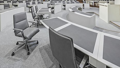 Sola chair in parliamentary chamber, seating arrangement scene