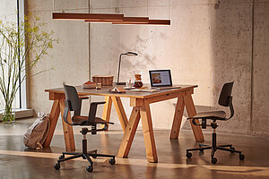 Wichair chairs at wooden worktable, studio workspace scene